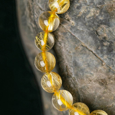 Vòng tay đá thạch anh tóc vàng charm mèo thần tài mệnh thủy, kim - Ngọc Quý Gemstones