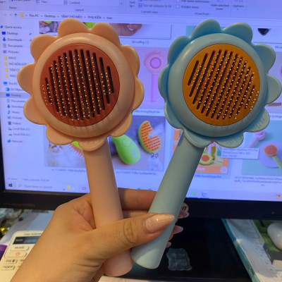 CÓ HỘP - Lược chải lông gỡ rối cho chó mèo hình hoa dướng dương có nút bấm đẩy lông thừa