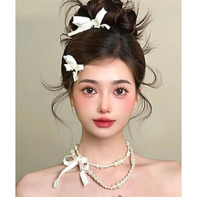 Dây chuyền hạt trai hai tầng đính nơ kèm nơ cài tóc