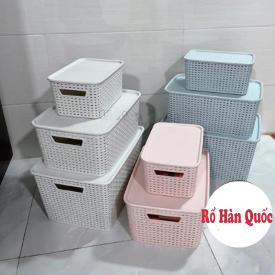 Thùng đựng đồ bằng nhựa giả mây có nắp đậy.