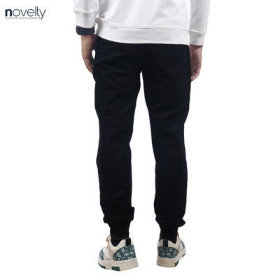 Quần jogger nam Novelty Regular fit họa tiết in phản quang đen NQGMMDMT3R230834Q